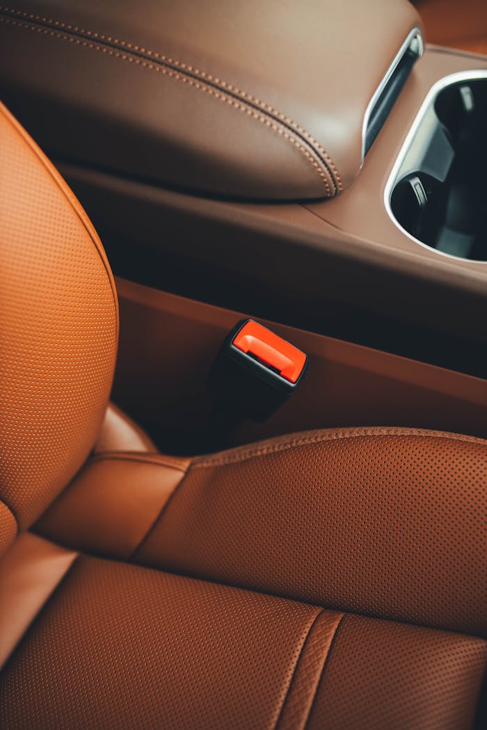 digital Close-up of a luxury cars brown leather interior showcasing sleek design and comfort.